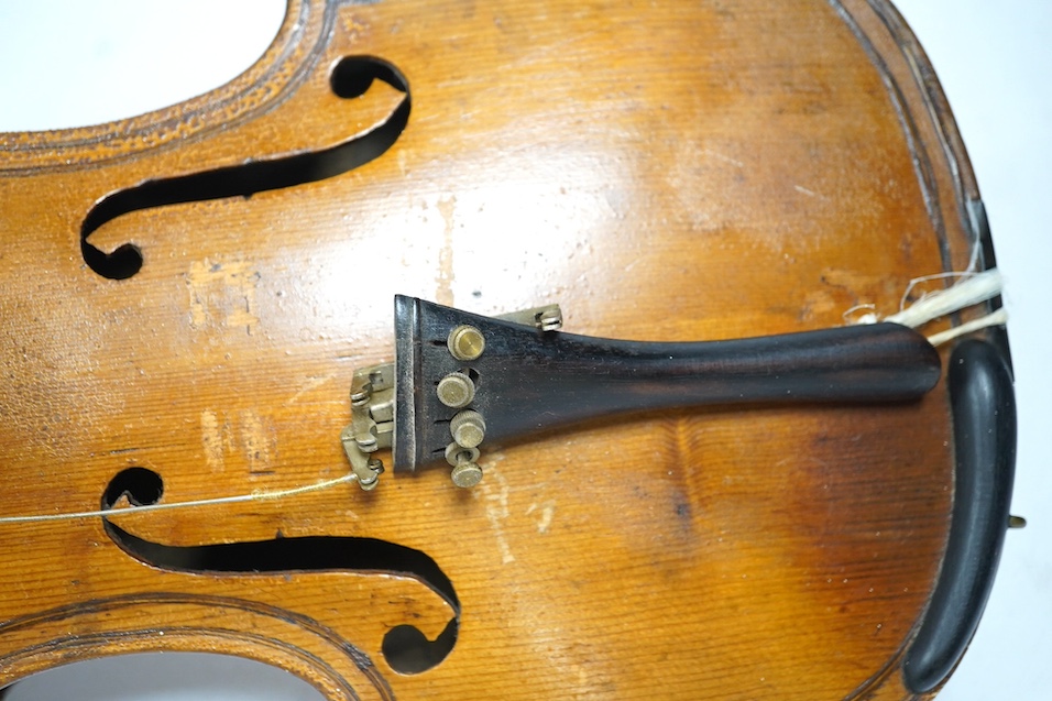 Two late 19th or early 20th century violins, one with case, back of largest measures 36cm. Condition - poor to fair